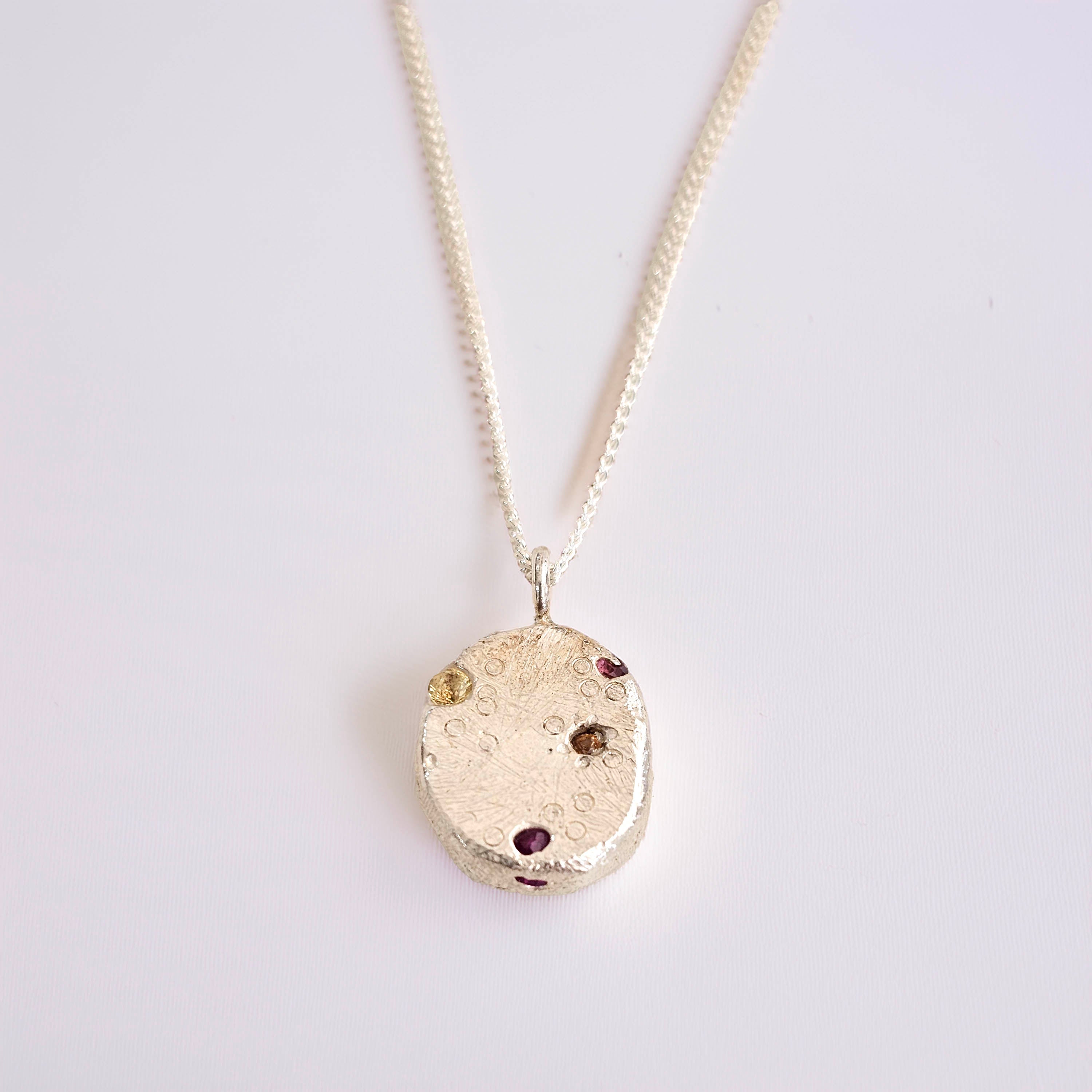 organic cast in place silver sapphire pendant handmade by zoe alexandria jewellery