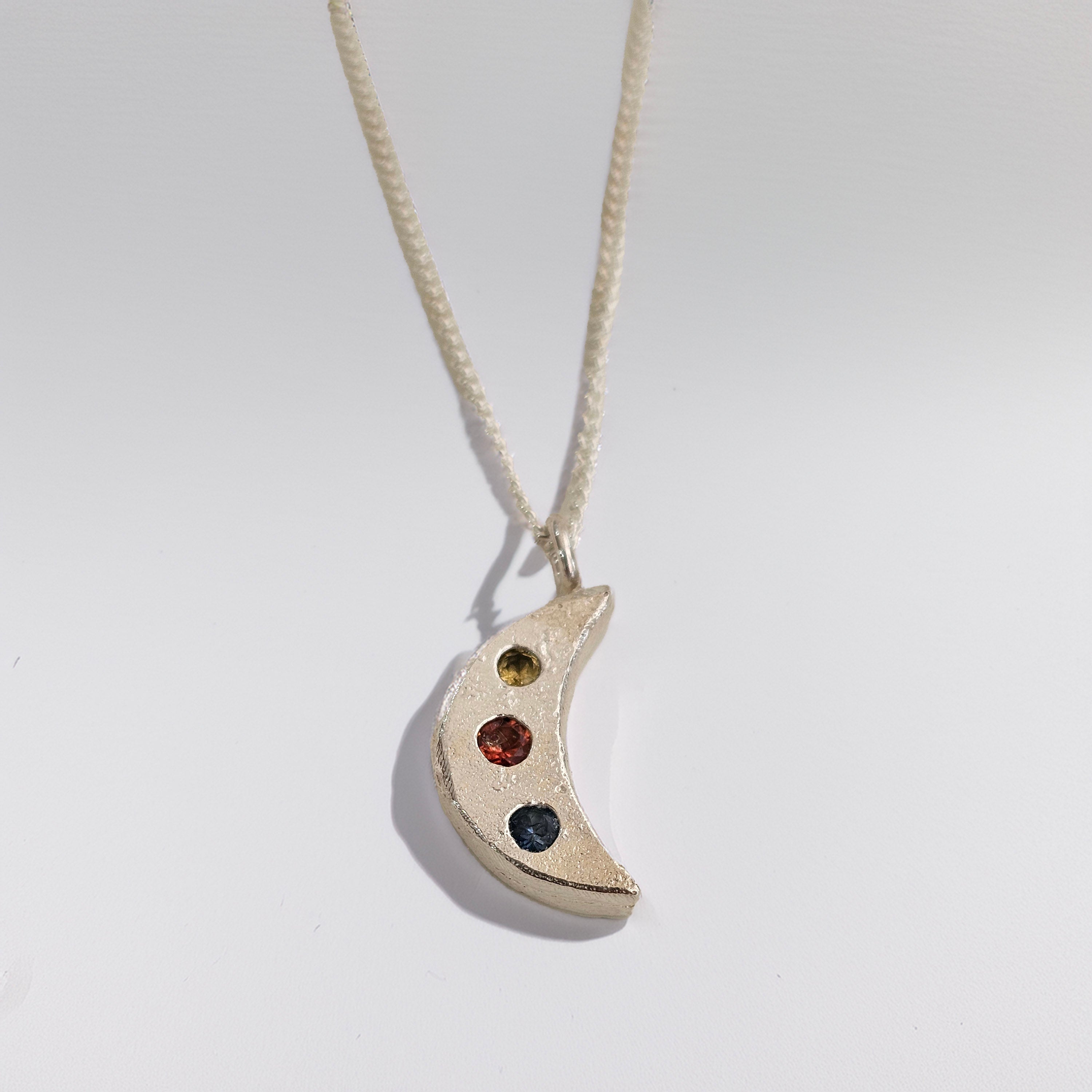 silver crescent moon necklace sapphire stones handmade by zoe alexandria