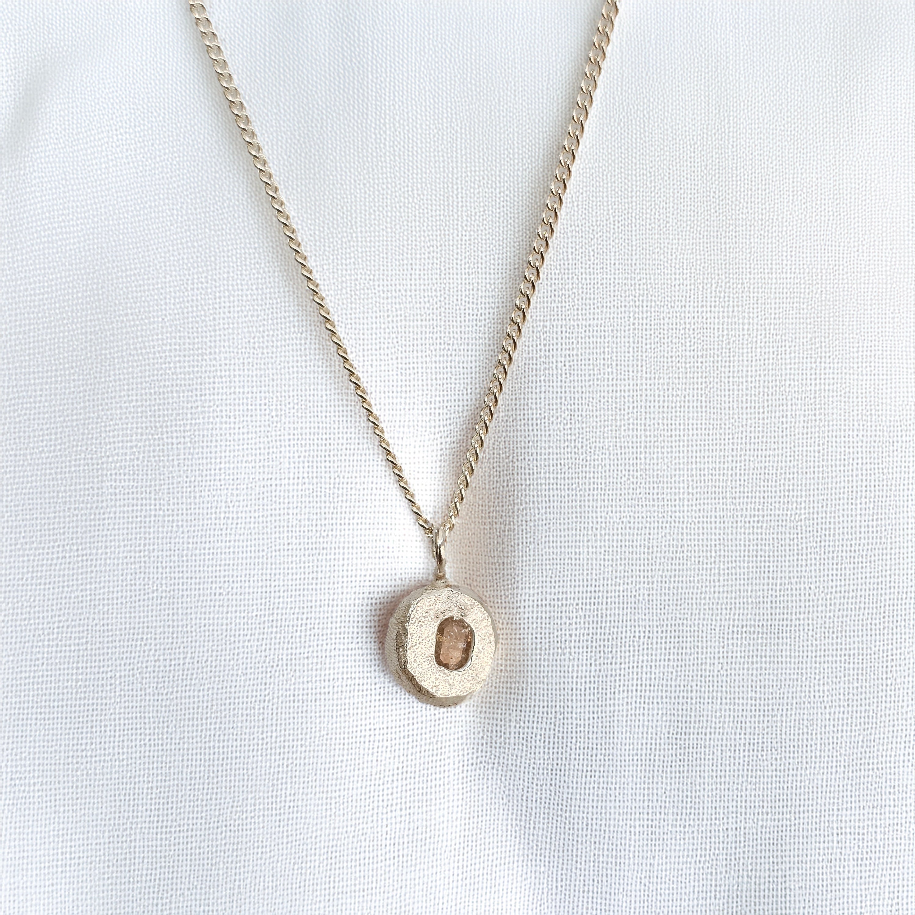 cast in place peach sapphire pendant by zoe alexandria jewellery recycled silver