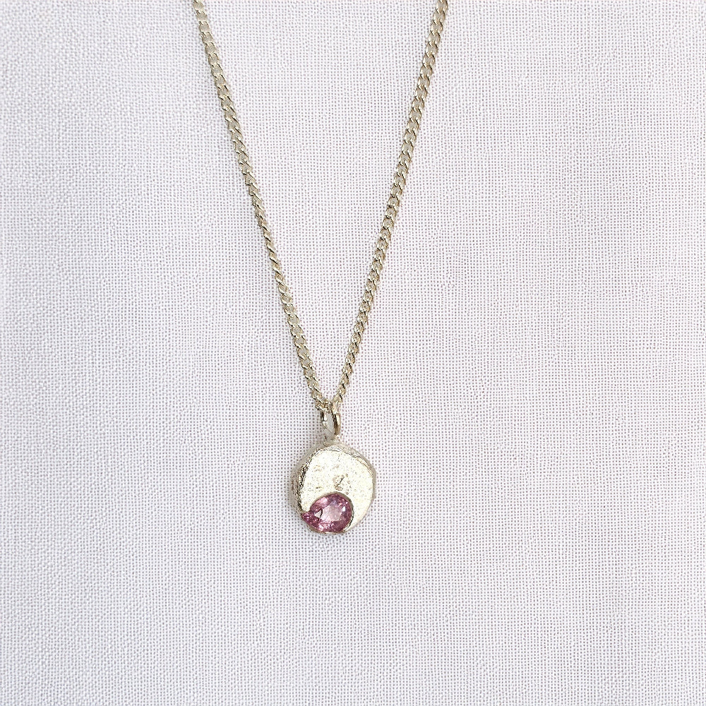 cast in place pink sapphire pendant by zoe alexandria jewellery recycled silver