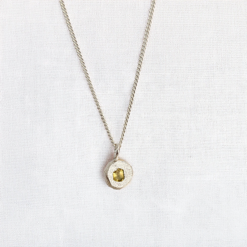 cast in place yellow sapphire pendant by zoe alexandria jewellery recycled silver