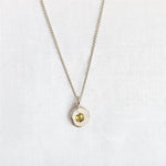 cast in place yellow sapphire pendant by zoe alexandria jewellery recycled silver