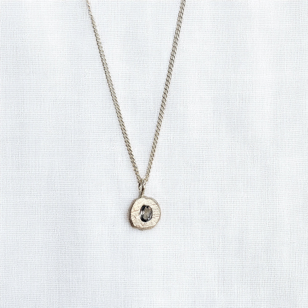 cast in place blue sapphire pendant by zoe alexandria jewellery recycled silver
